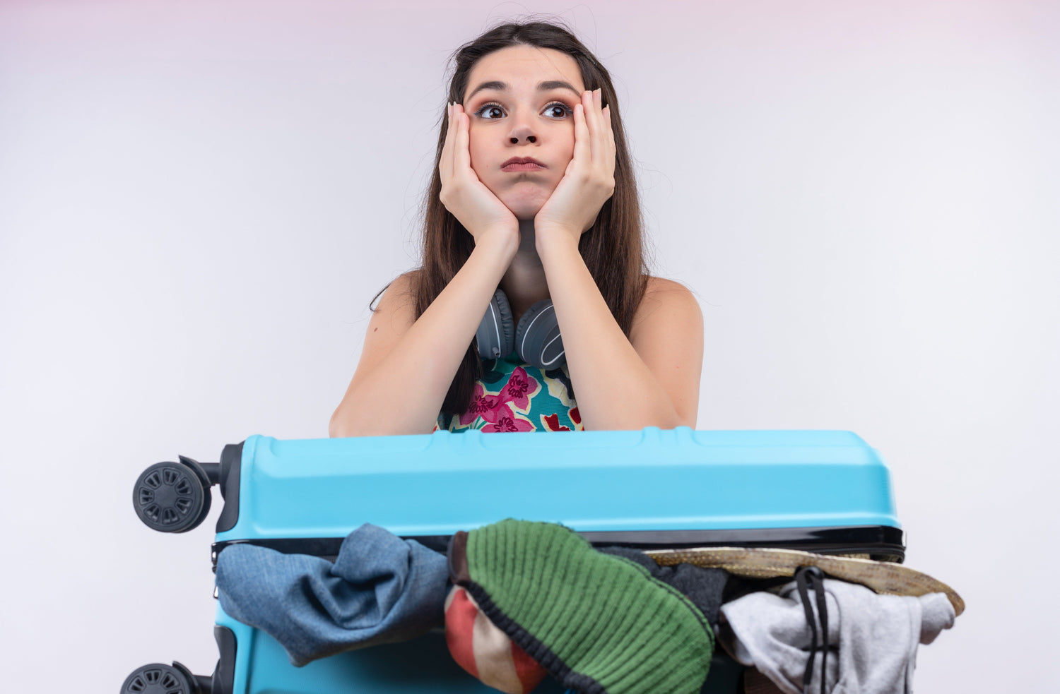anxious-young-traveler-woman-holding-with-suitcase