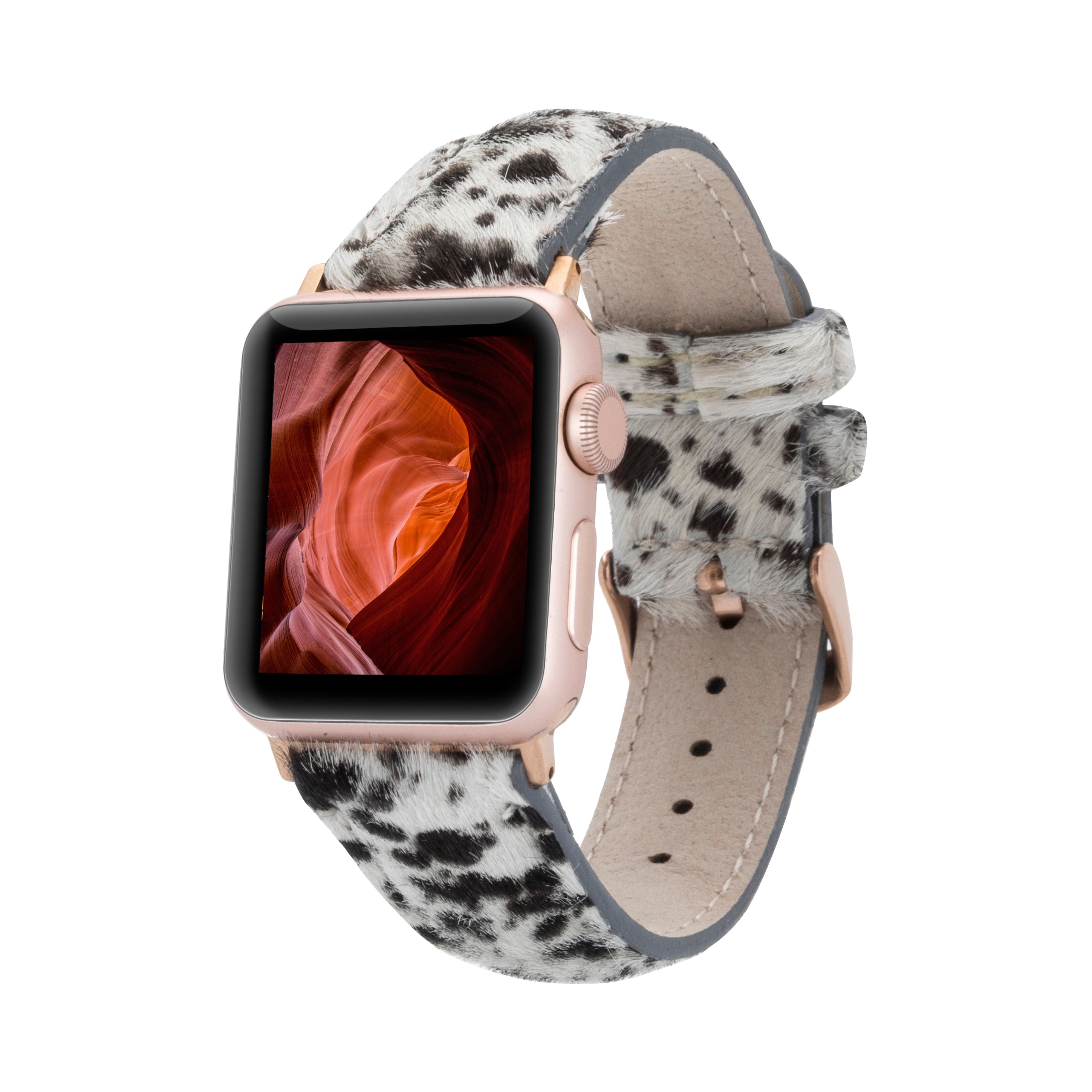 A stylish apple watch band with a quilted texture, featuring a mix of dark and light spots, possibly made from genuine leather.