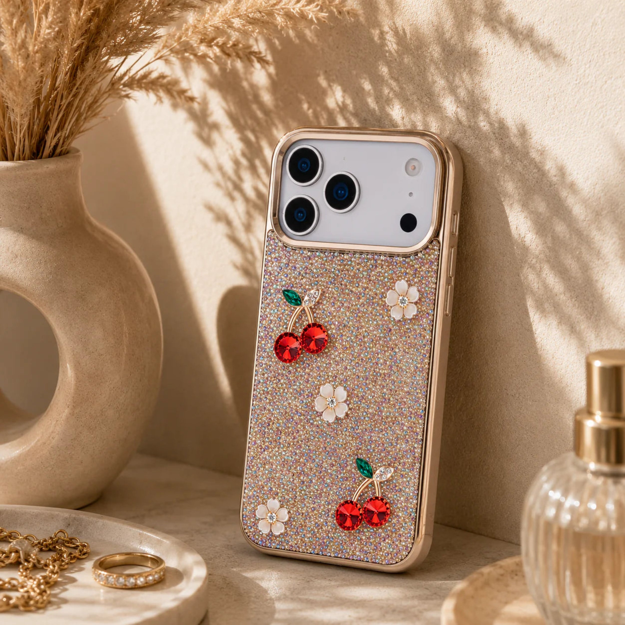 Phone case with cherry and flower designs on a decorative surface