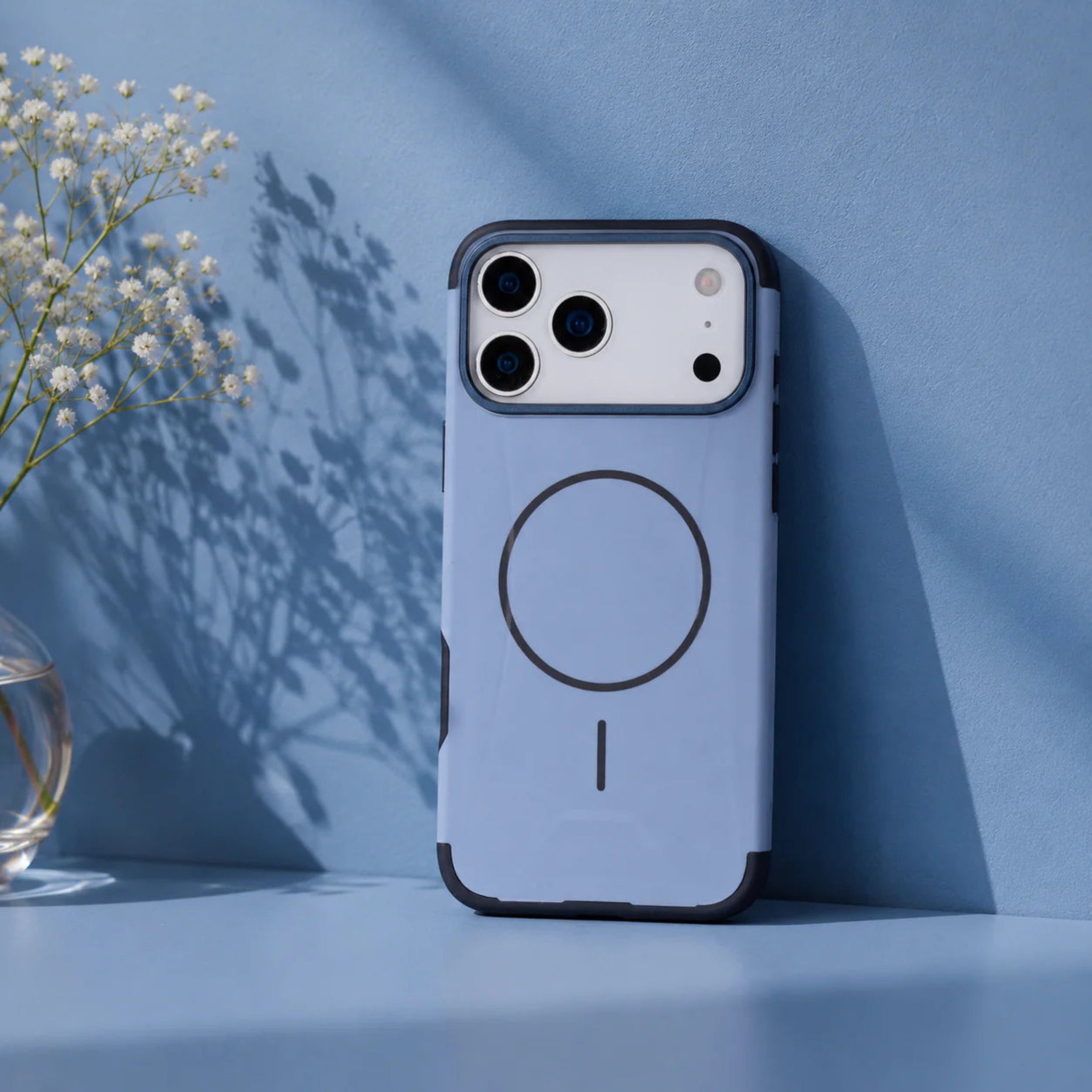 Blue phone case with a magnetic design on a blue background