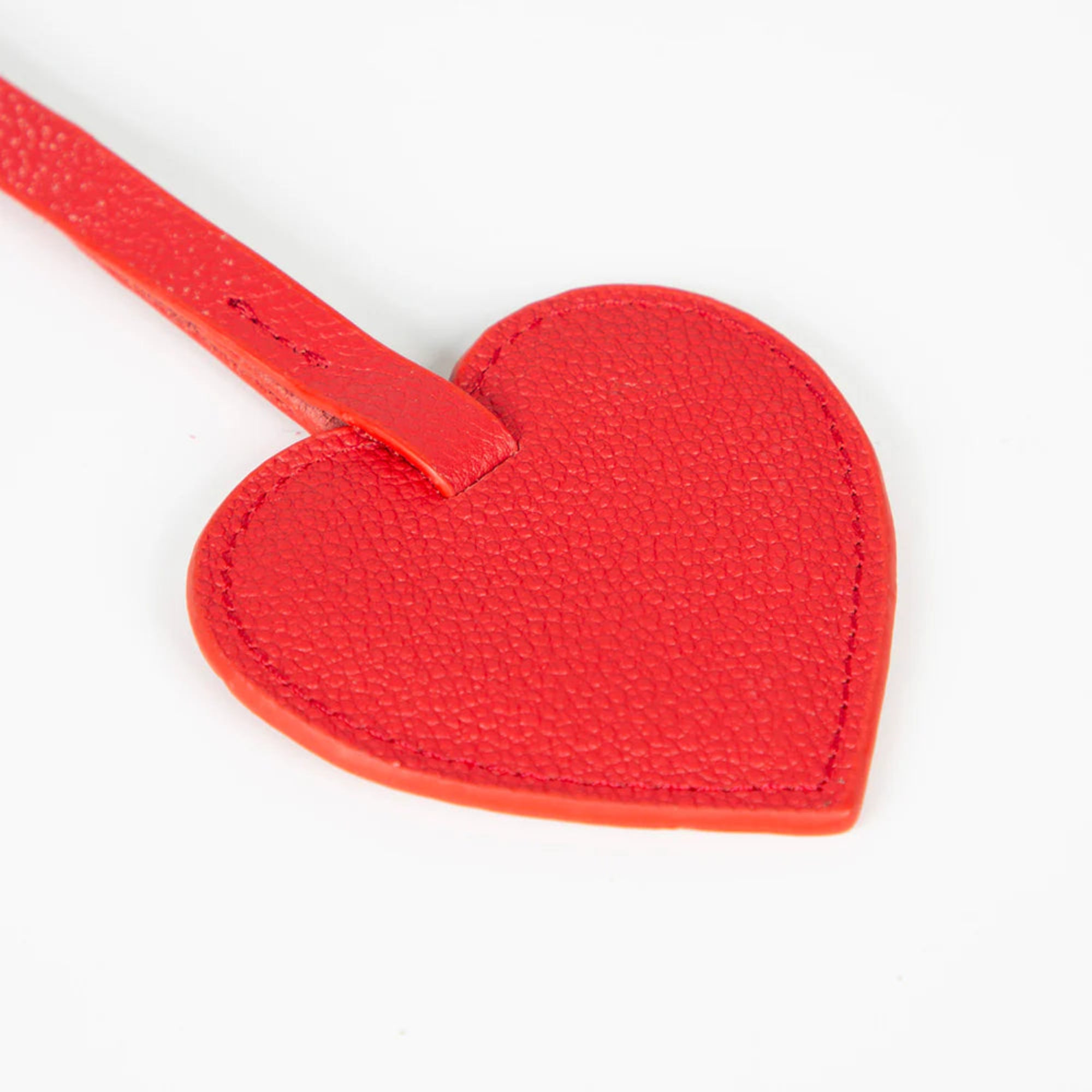 Red heart-shaped keychain on a white background