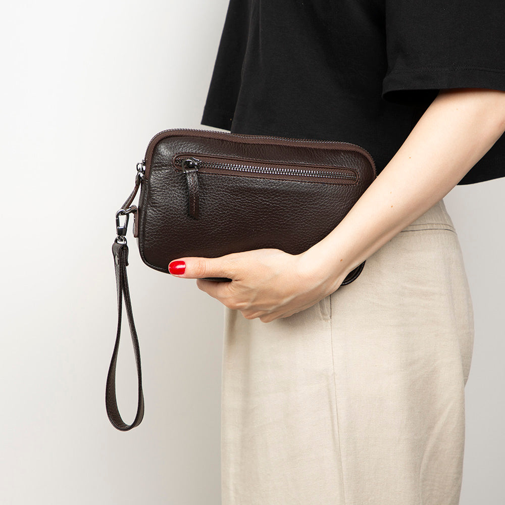 Handmade leather clutch with multiple compartments and secure zipper closure