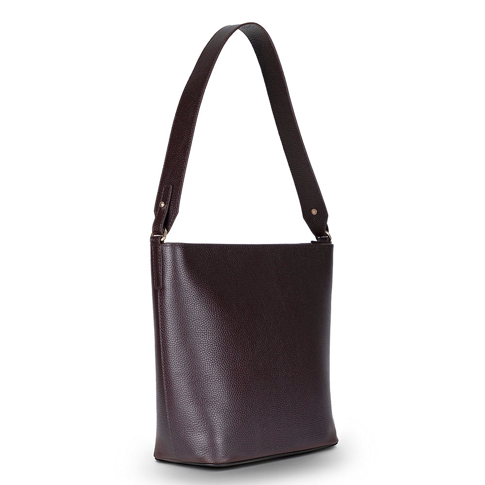 Brown leather shoulder bag on a white background