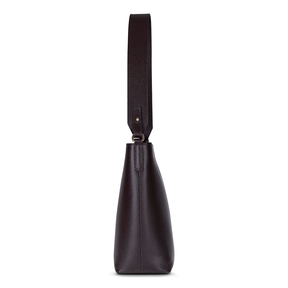 Black leather handbag with a strap on a white background