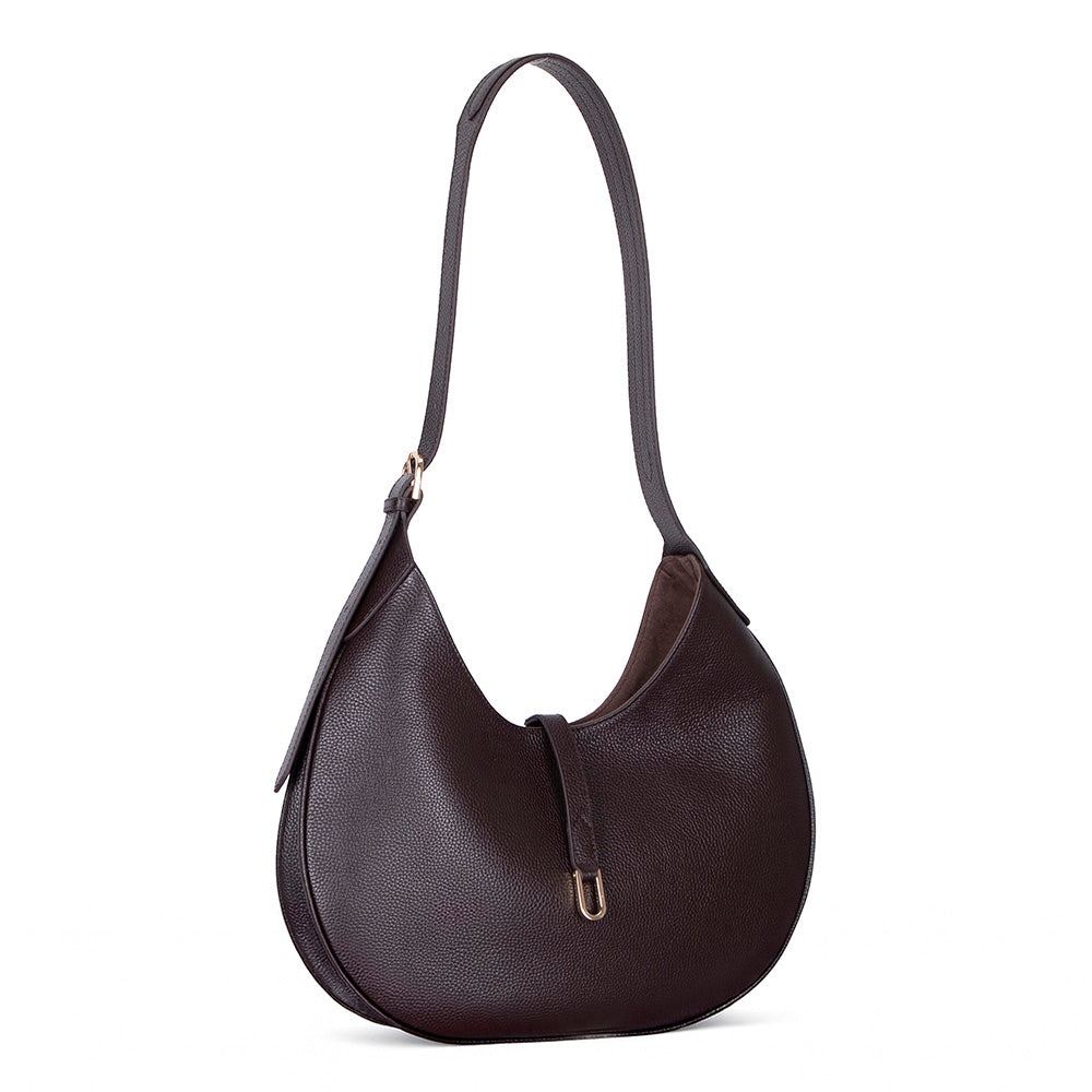 Brown leather handbag with a strap on a white background