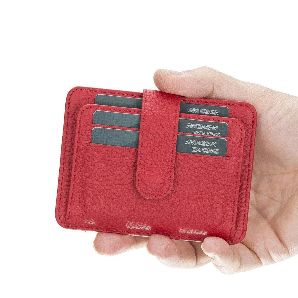 Red wallet with American Express cards held in a hand on a white background
