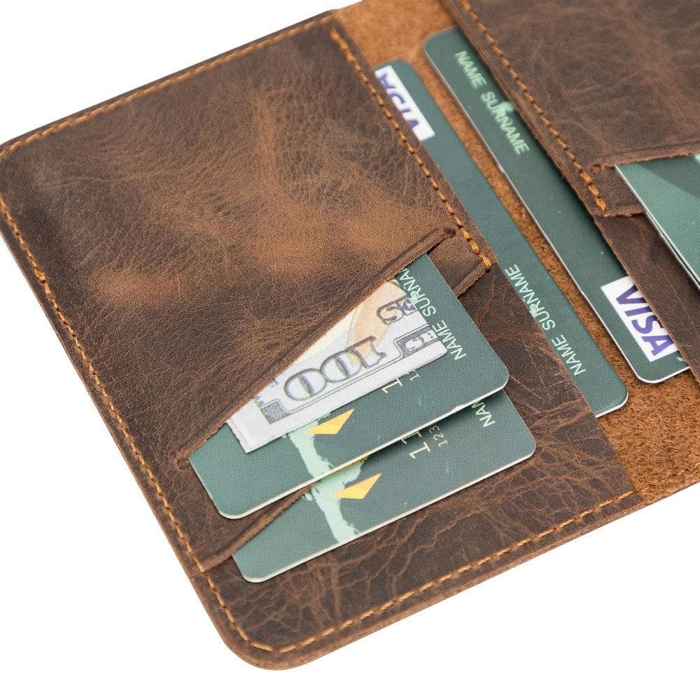 Brown leather wallet with cards and money on a white background