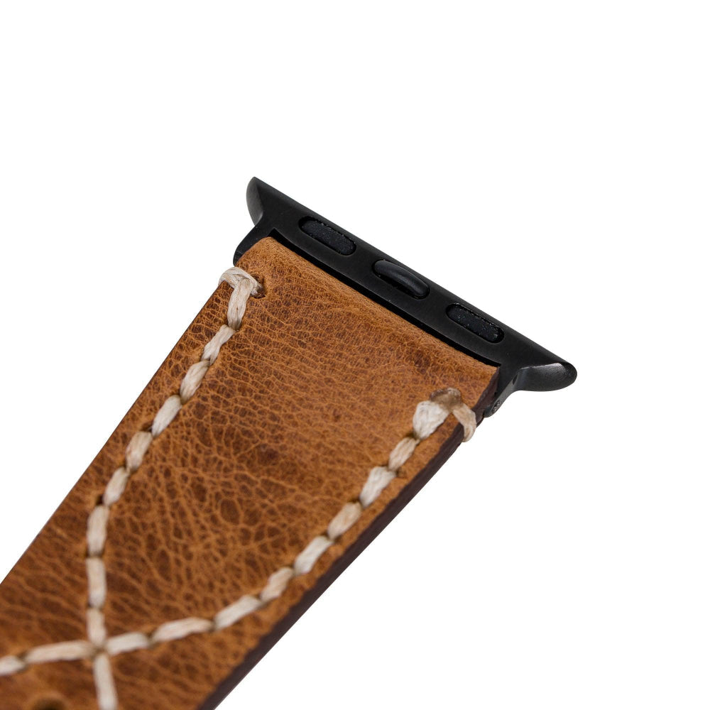 Brown leather watch strap with black metal clasp on a white background