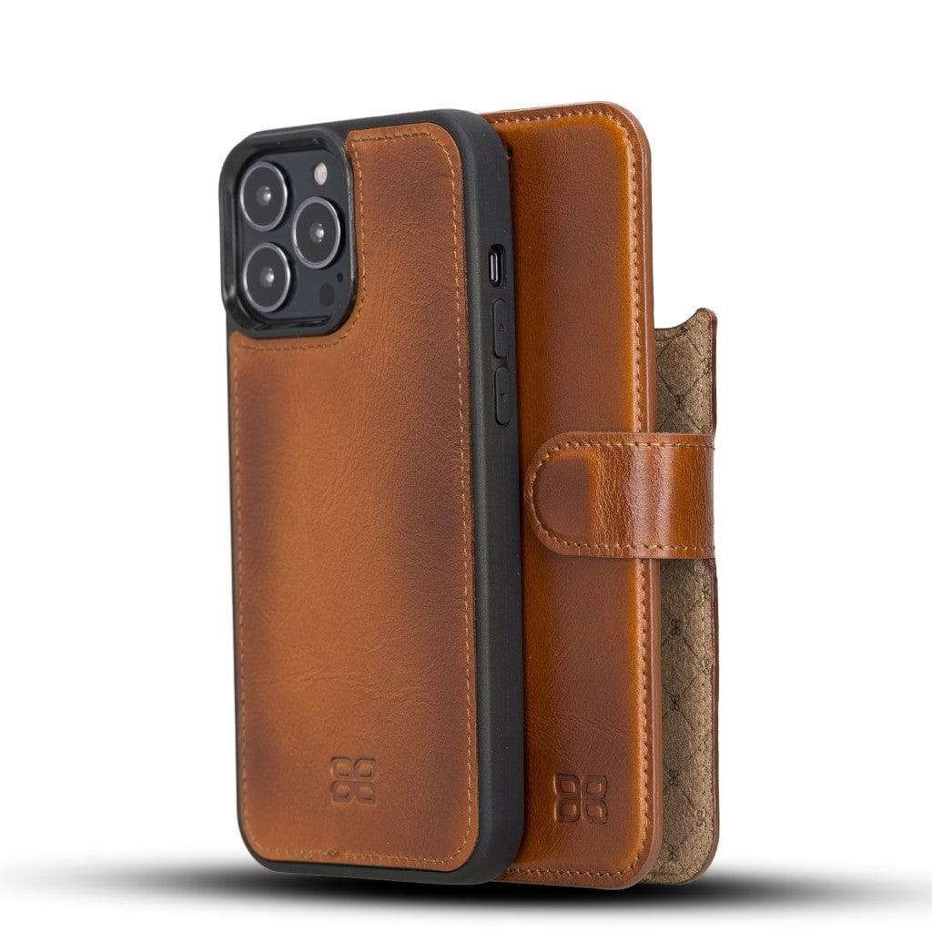A brown genuine leather wallet case for iPhone 13 series with a detachable cover, displayed in a standing position with the front flap open, showcasing the interior with card slots and a banknote compartment.