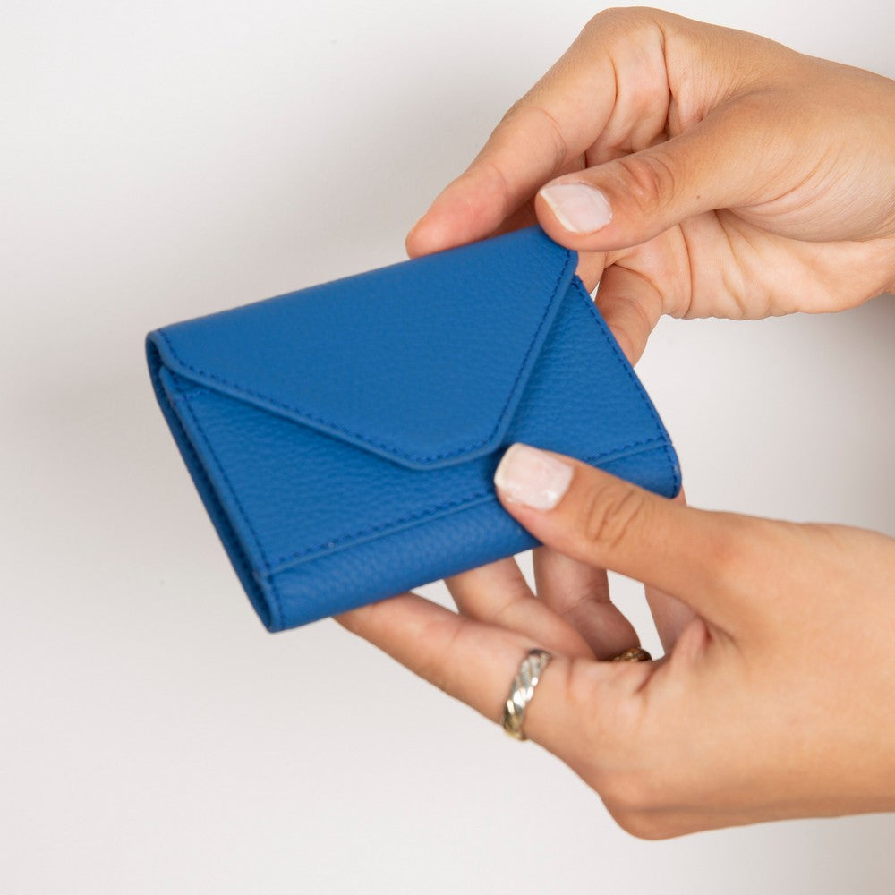 Compact leather card wallet holding 12 cards and cash