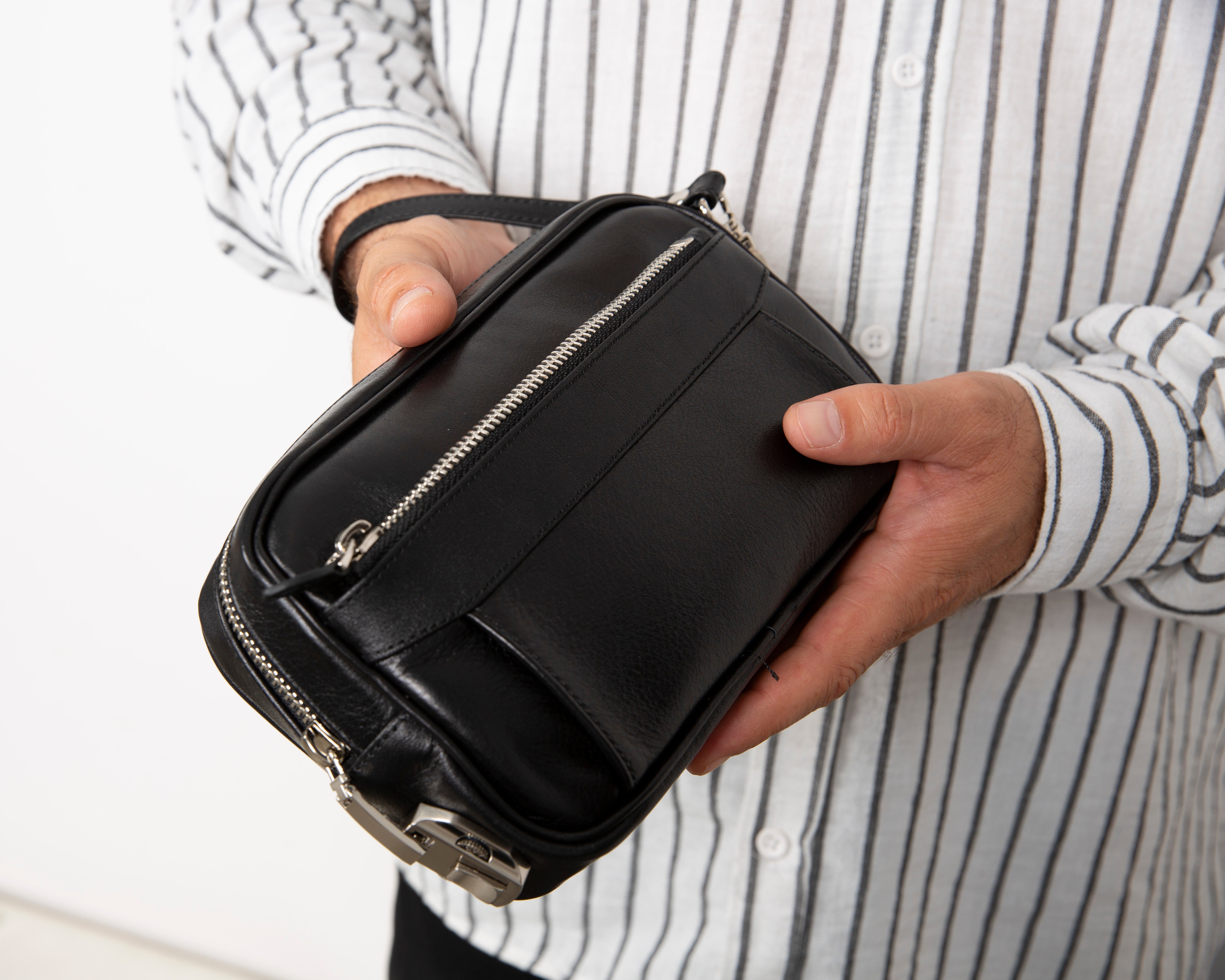 Handmade leather travel handbag with safety lock and hanging loop