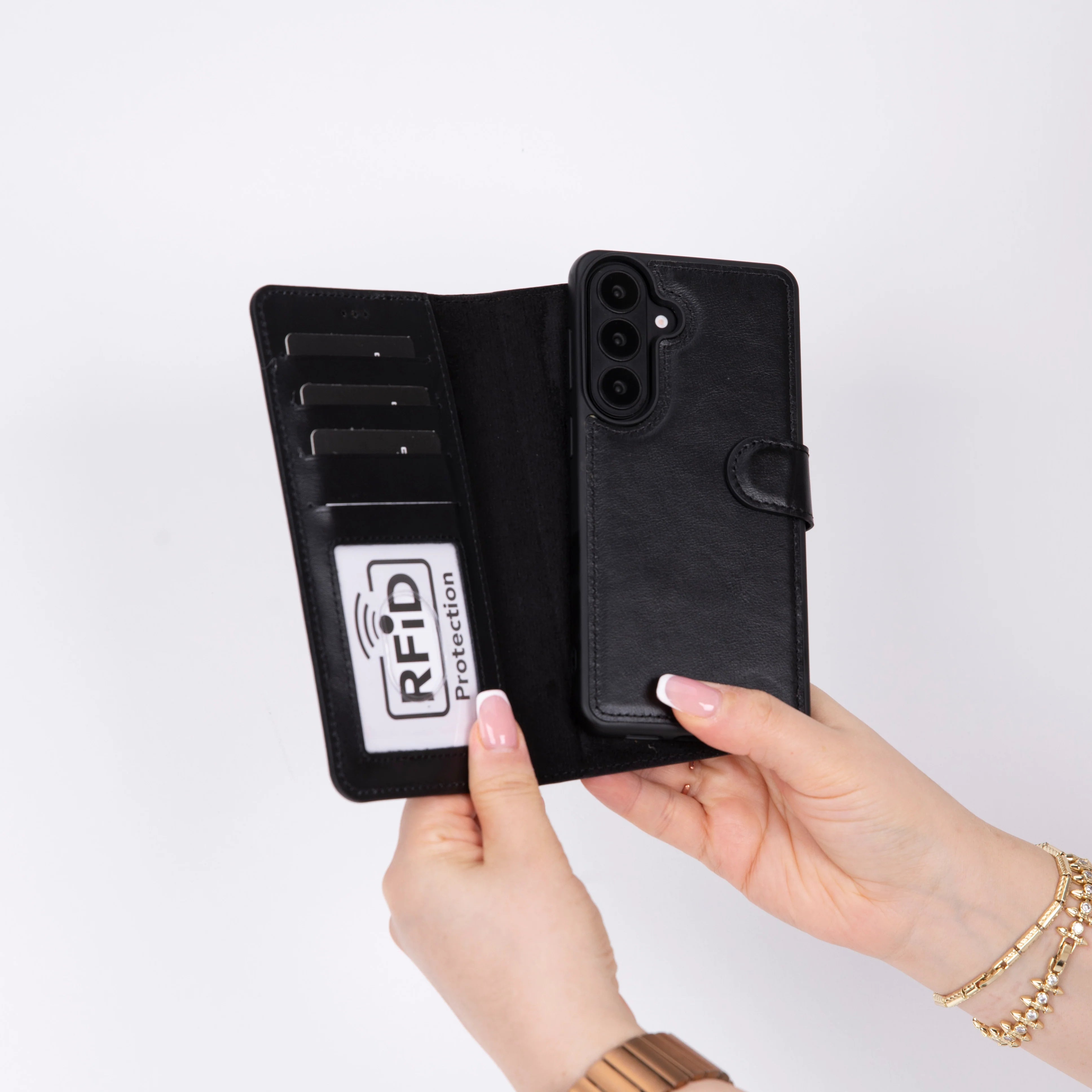 Black Galaxy S26 case with RFID protection feature held by a hand on a white background
