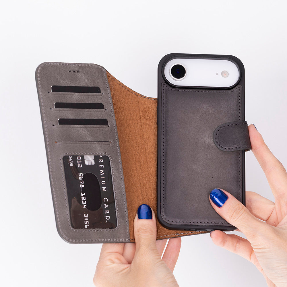 Person holding a phone case with card slots on a white background