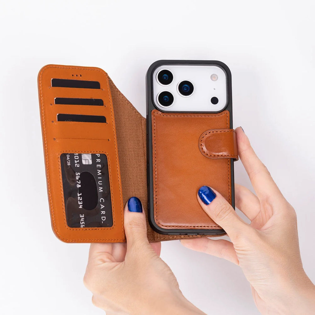 Brown phone case with card slots held by a hand on a white background