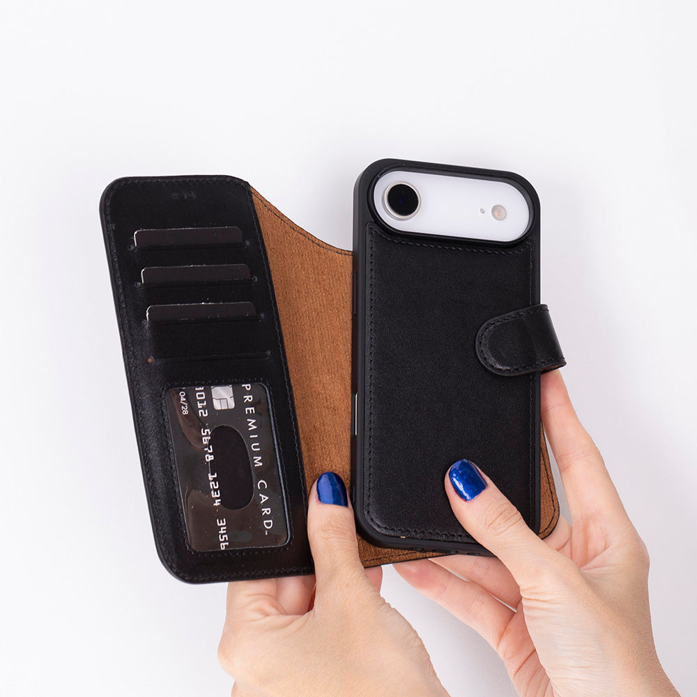 Black phone case with card holder held by a hand on a white background