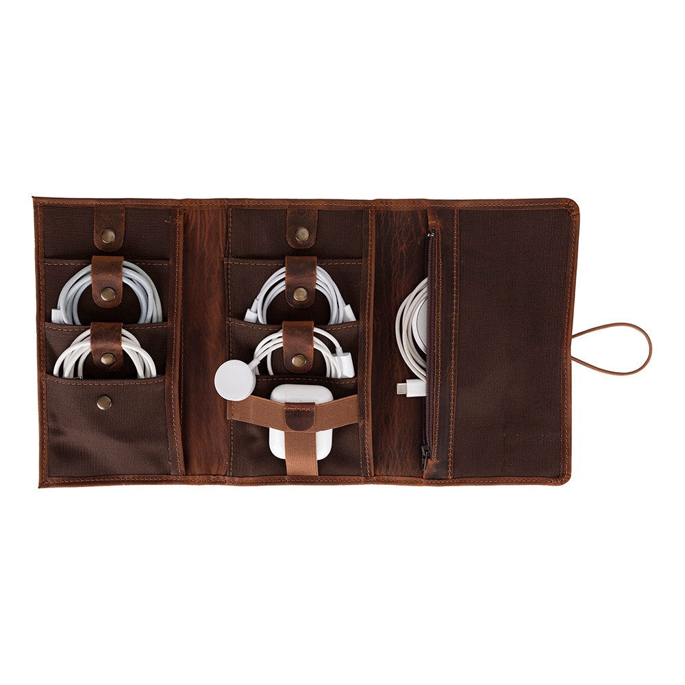Brown leather cable organizer with multiple cables on a white background