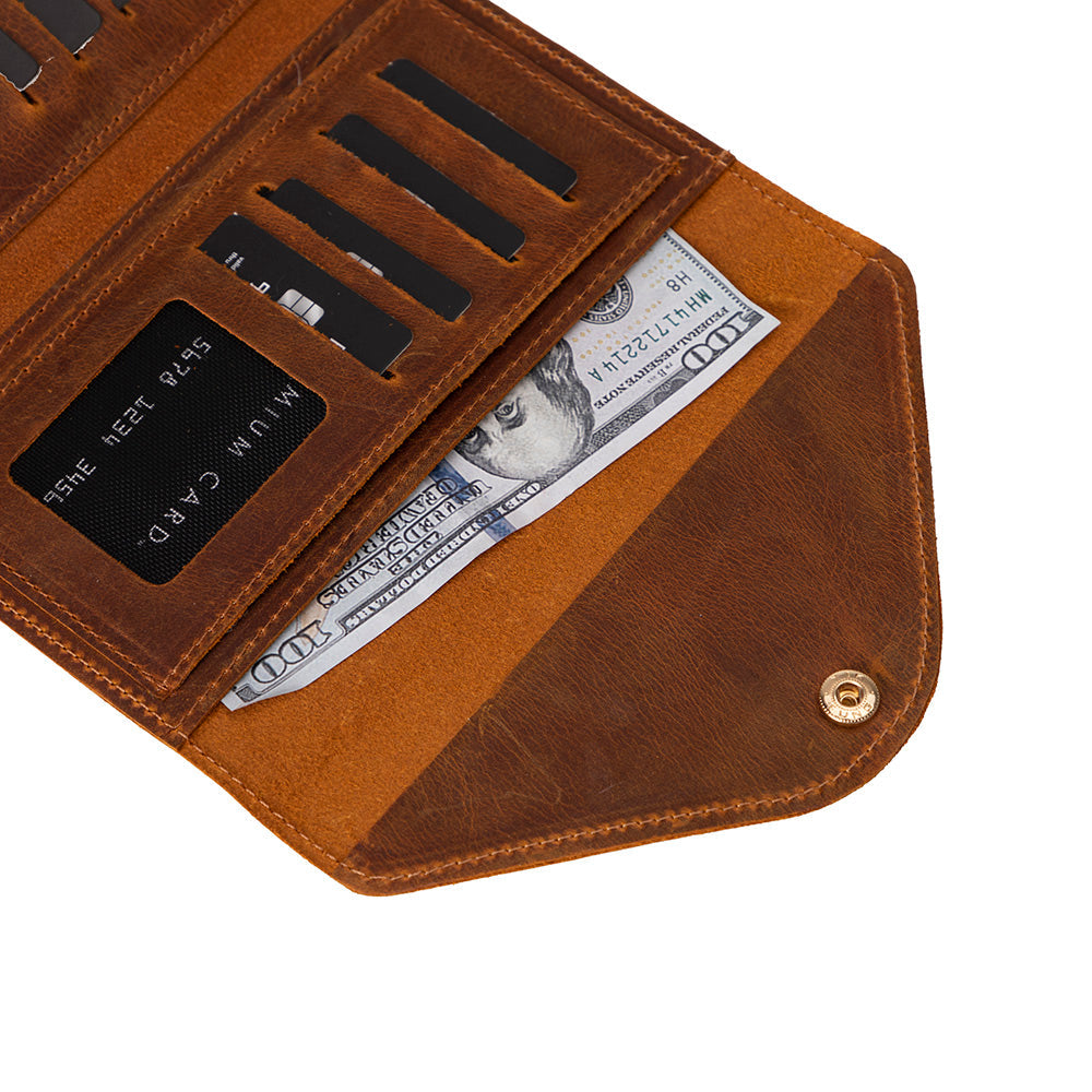 Brown leather wallet with money and cards on a white background