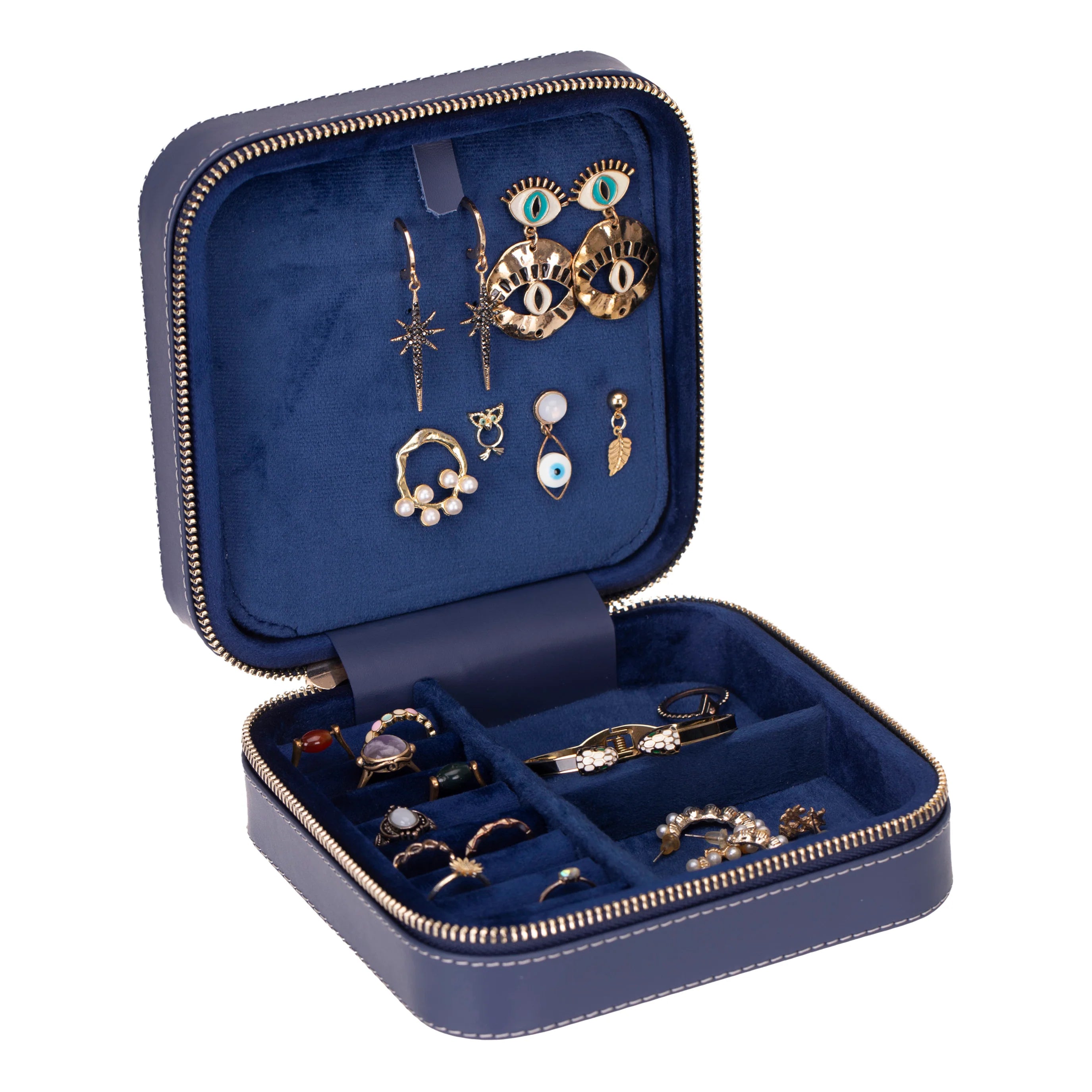 Open blue jewelry case with various earrings on a white background