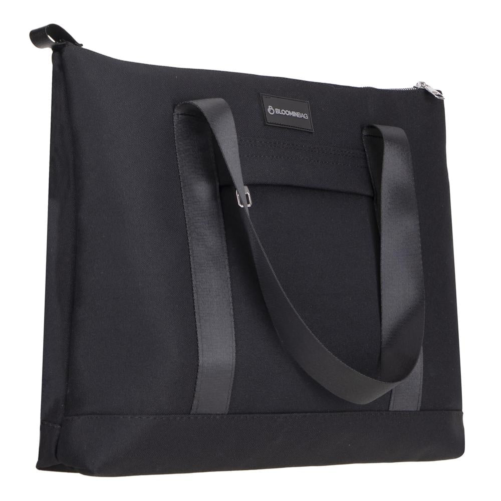 Durable cruelty-free tote bag with long straps and laptop sleeve compatibility