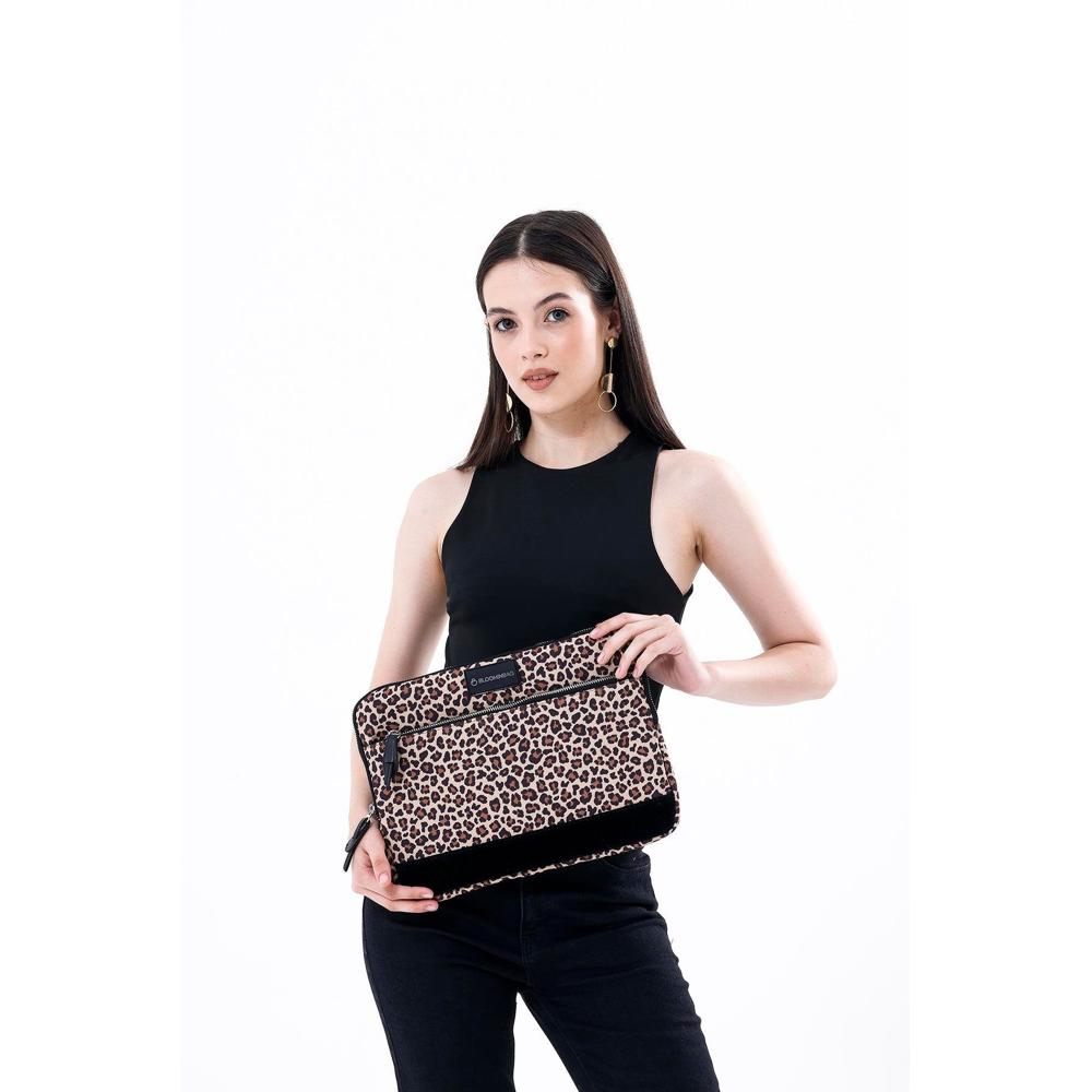 Woman holding a leopard print clutch bag on a white background