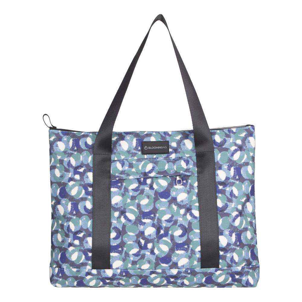 Patterned tote bag with black straps on a white background
