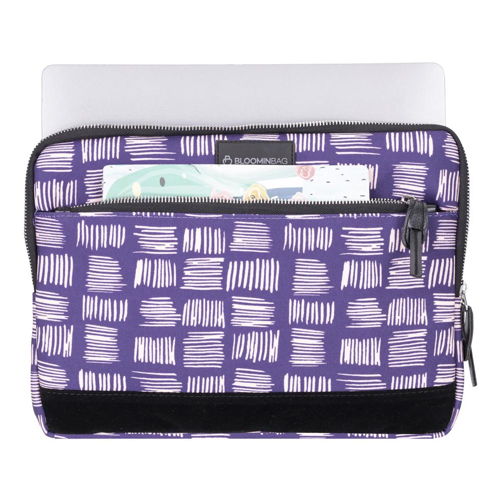 Purple and white patterned laptop sleeve with a visible brand logo on a white background