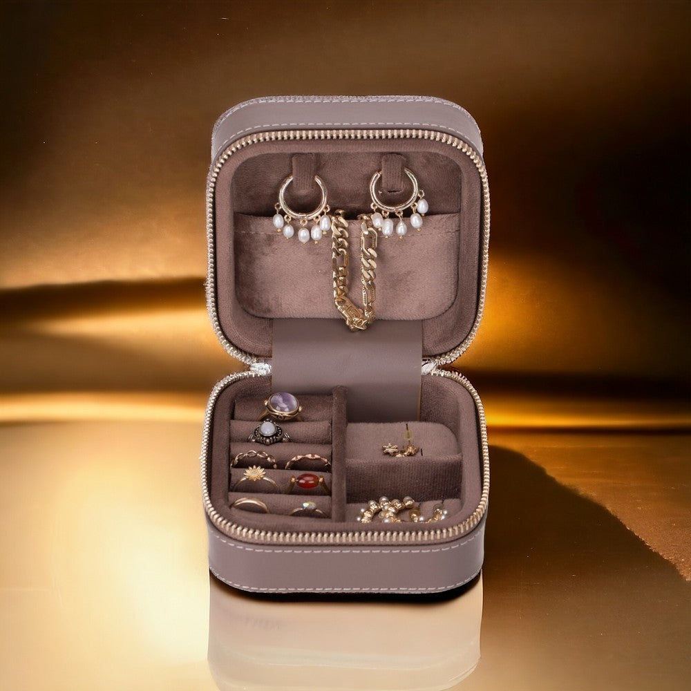 Compact genuine leather jewelry box with velvet lining for organized travel and home storage 